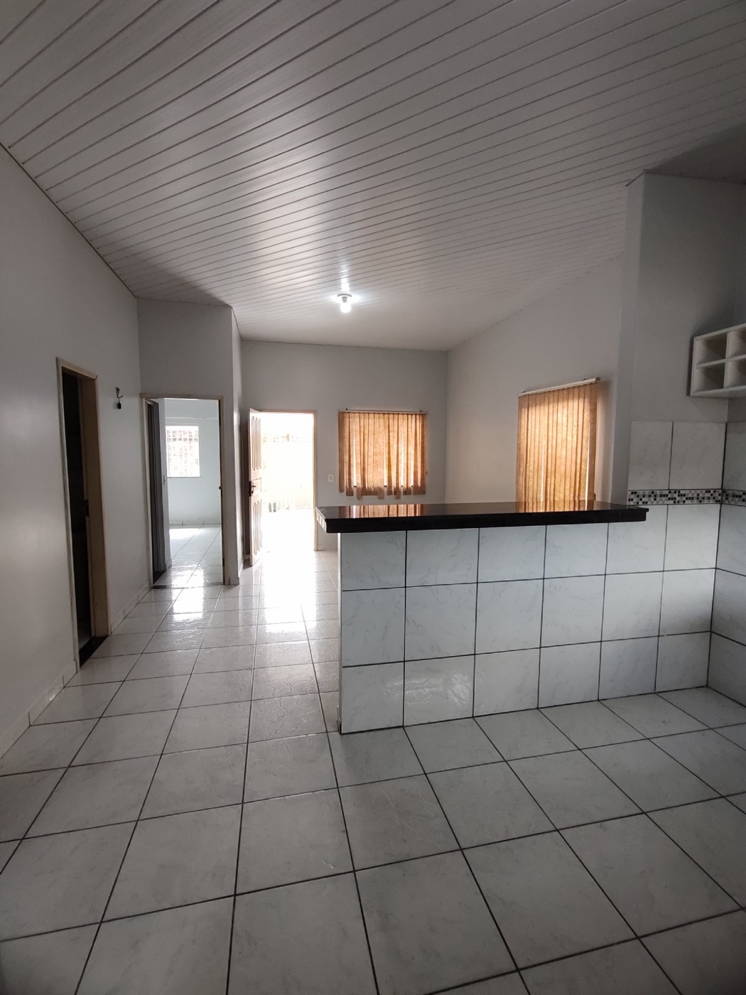 Sala com bancada americana de casa na Cidade Nova